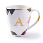 Caneca de porcelana manchas iniciais